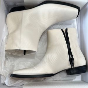 they’re very good quality leather booties. White cream color size 7